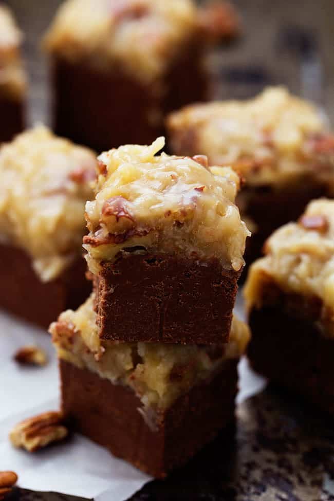 german chocolate fudge squares in a stack.