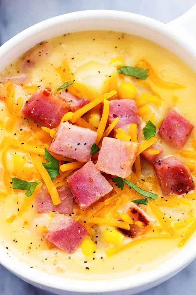 Ham and Potato Cheddar Soup in a white bowl.