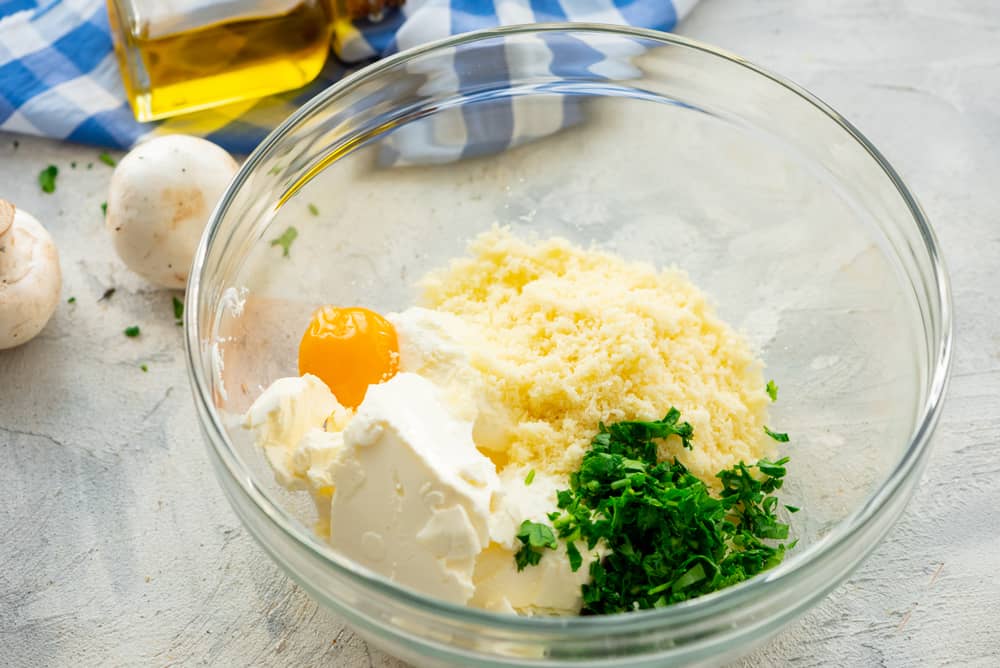 All the ingredients for the cream cheese filling in a glass bowl.