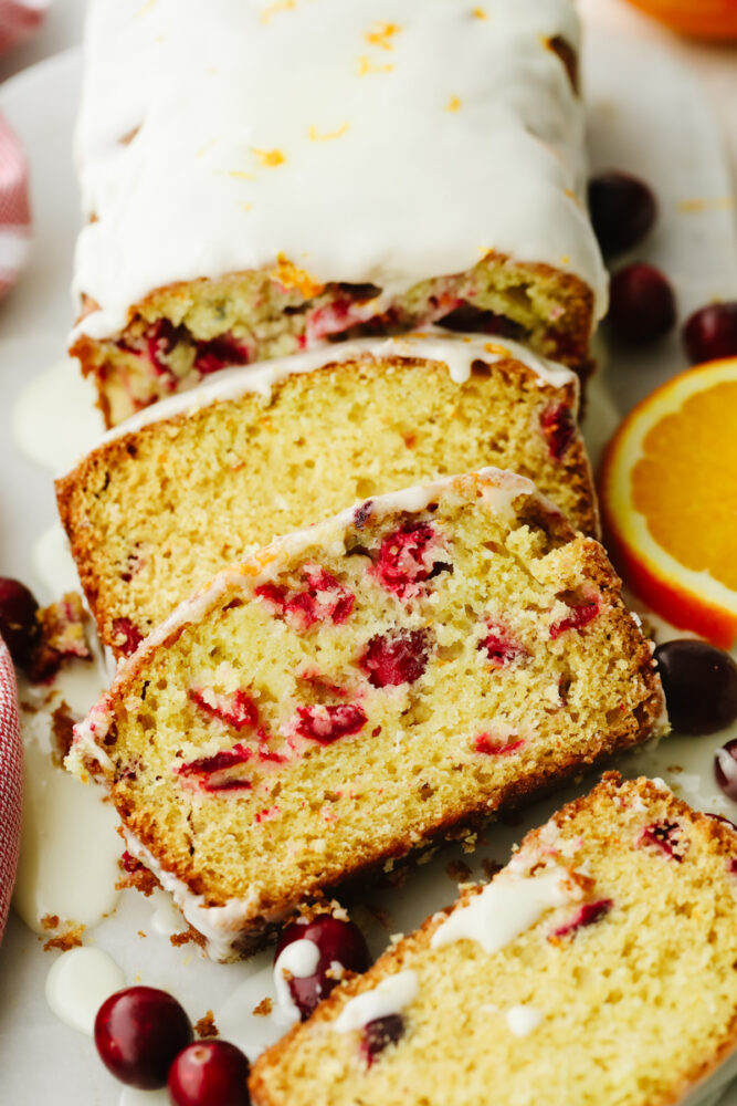 A loaf of sliced cranberry orange bread. 