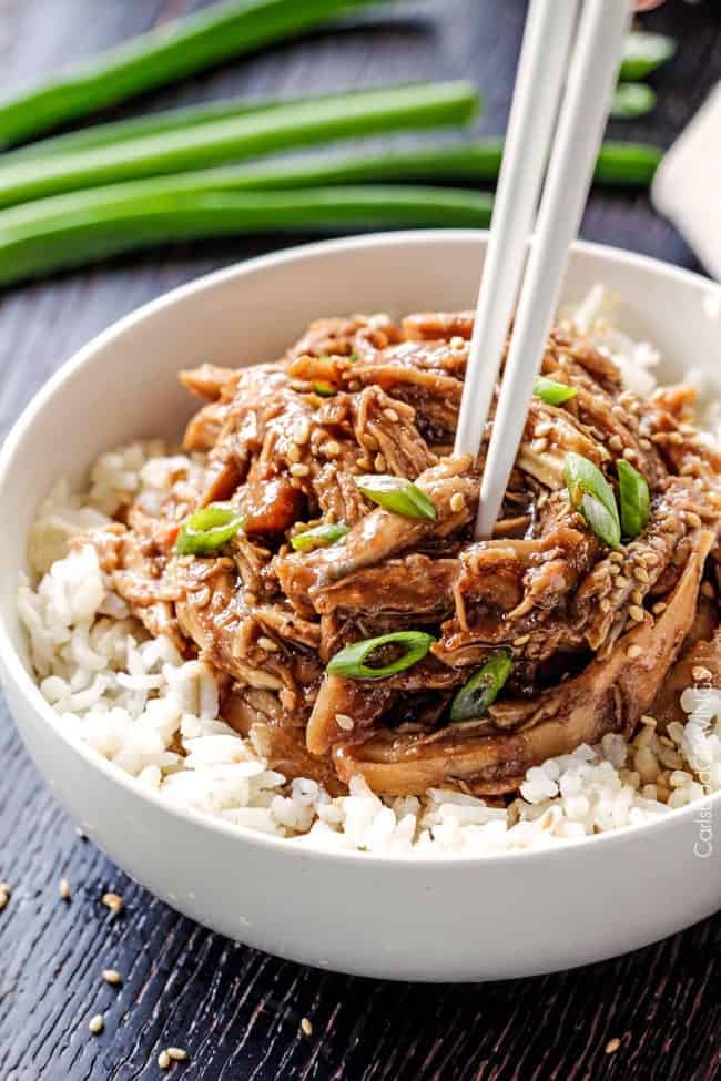 Honey Soy Chicken over white rice in white bowl.