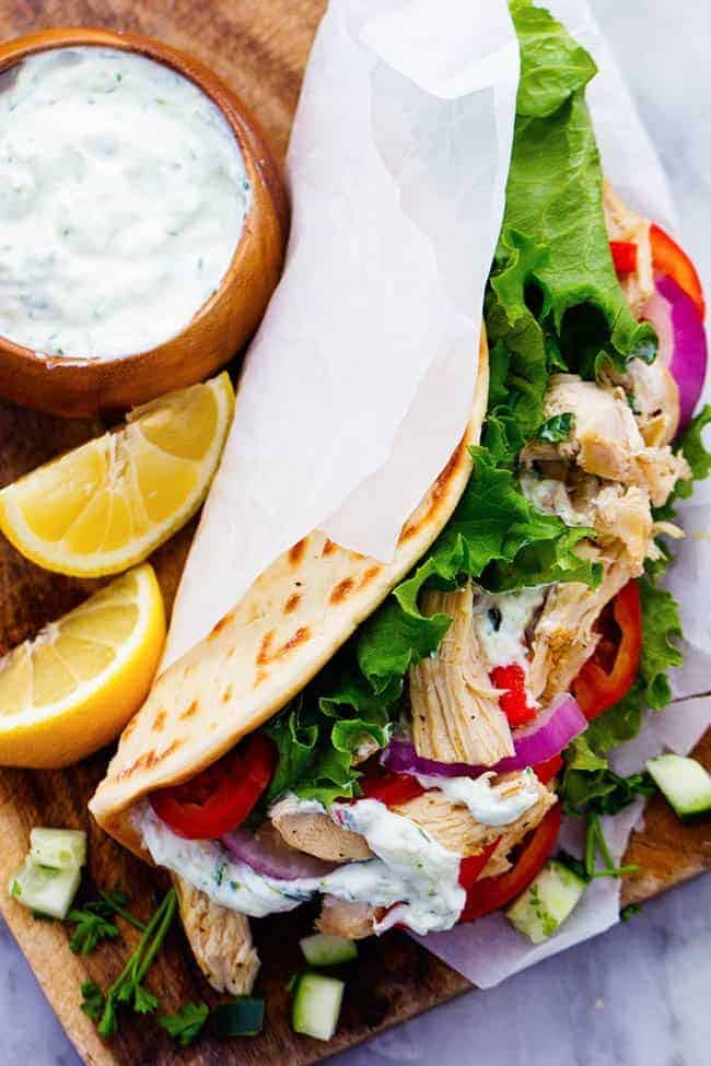 Slow Cooker Greek Chicken Gyros with Tzatziki seasoned chicken, tender vegetables and a classic cool cucumber sauce wrapped in a flat bread