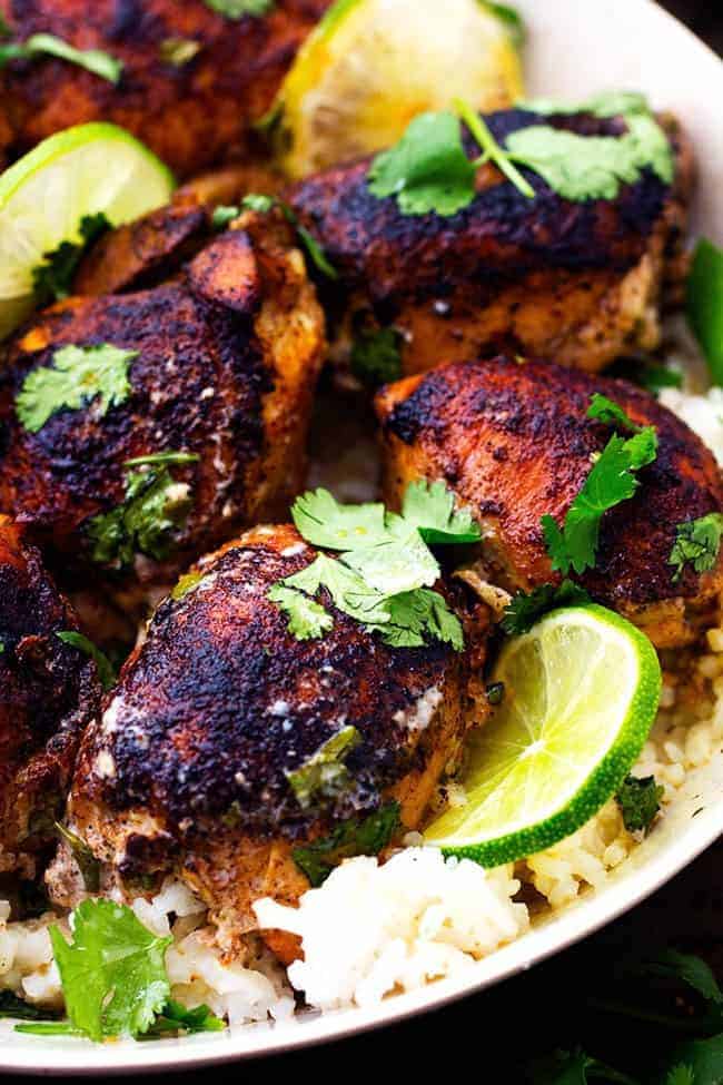 Slow Cooker Creamy Cilantro Lime Chicken in a white bowl over rice.  