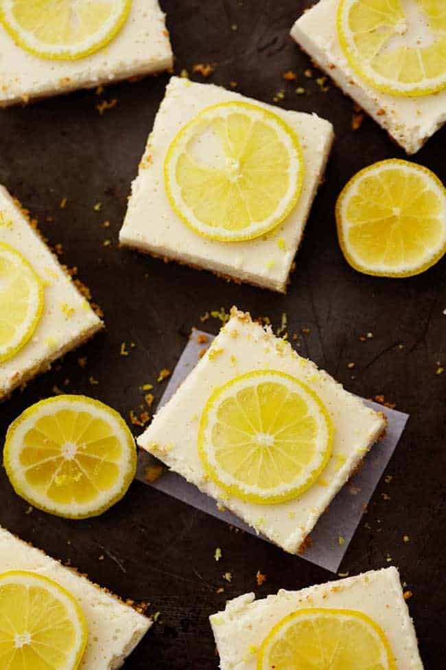 Lemon icebox bars with sliced lemons on top.