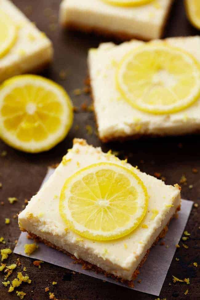 Lemon Icebox bars with lemon slice on top.