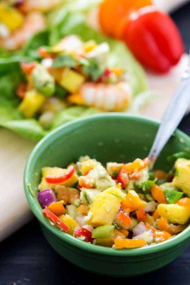 Mango avocado salsa in a green bowl.