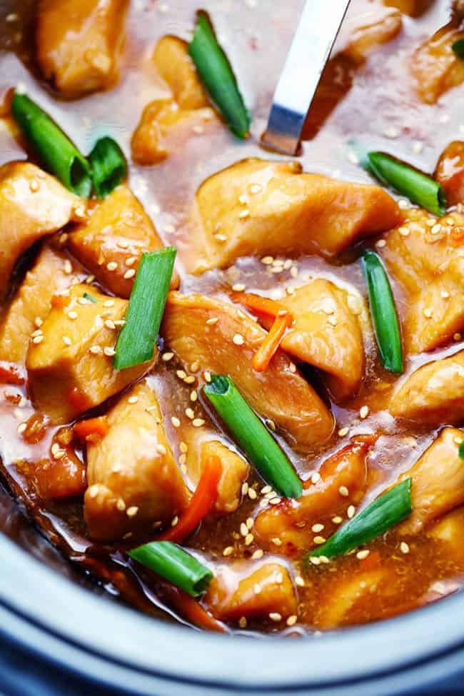 Mongolian chicken with green onions in a slow cooker.