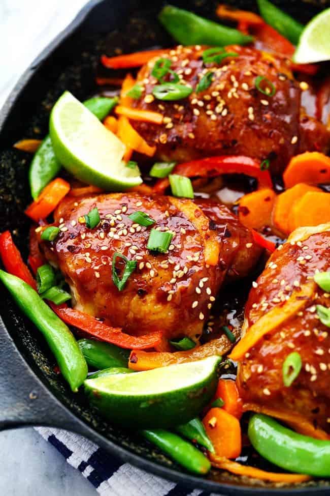 Thai Peanut Skillet Chicken with lime and other fresh vegetables.