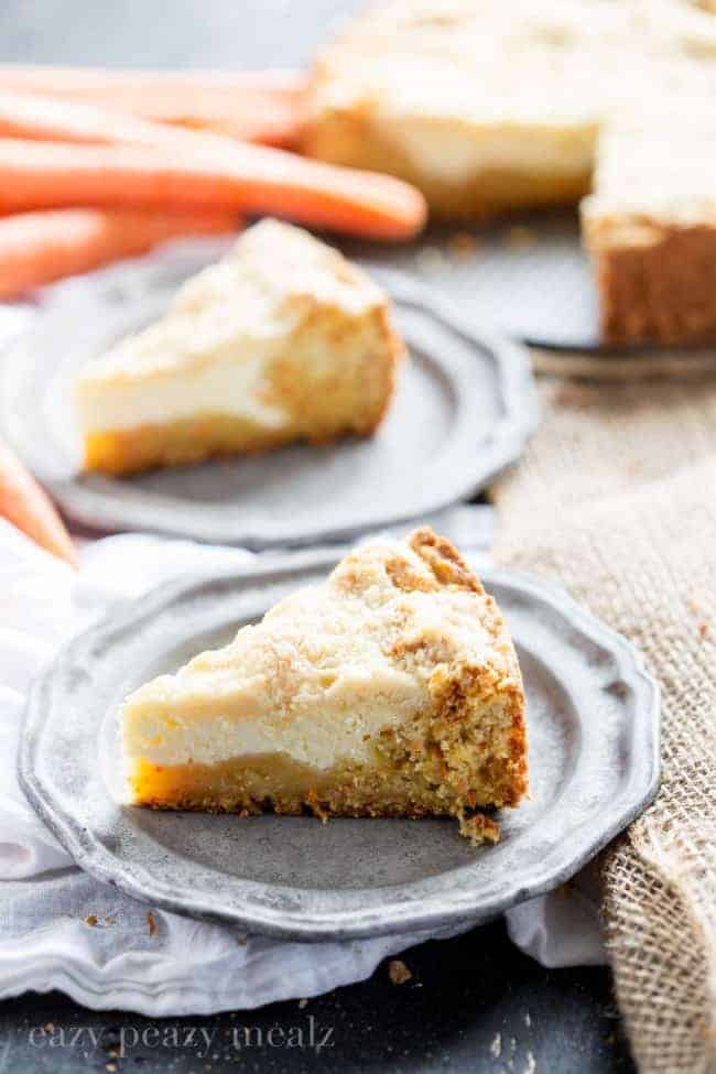 Slices of carrot coffee cake on grey plates.