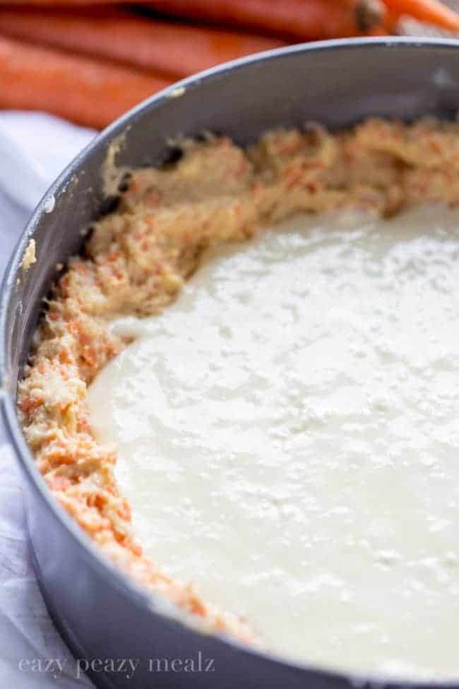 Carrot coffee cake in a mixing bowlWith cream cheese filling.