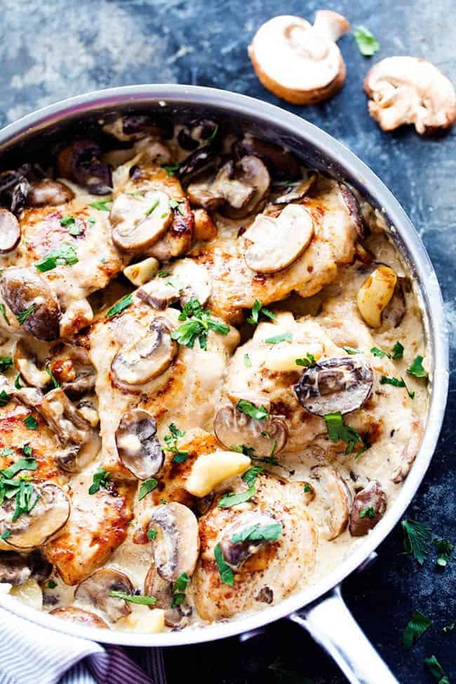 Creamy garlic mushroom chicken in a frying pan.