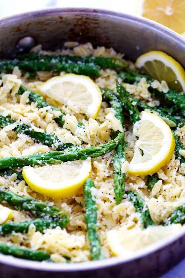 Lemon Parmesan Garlic Orzo with Asparagus in a large metal pot. 