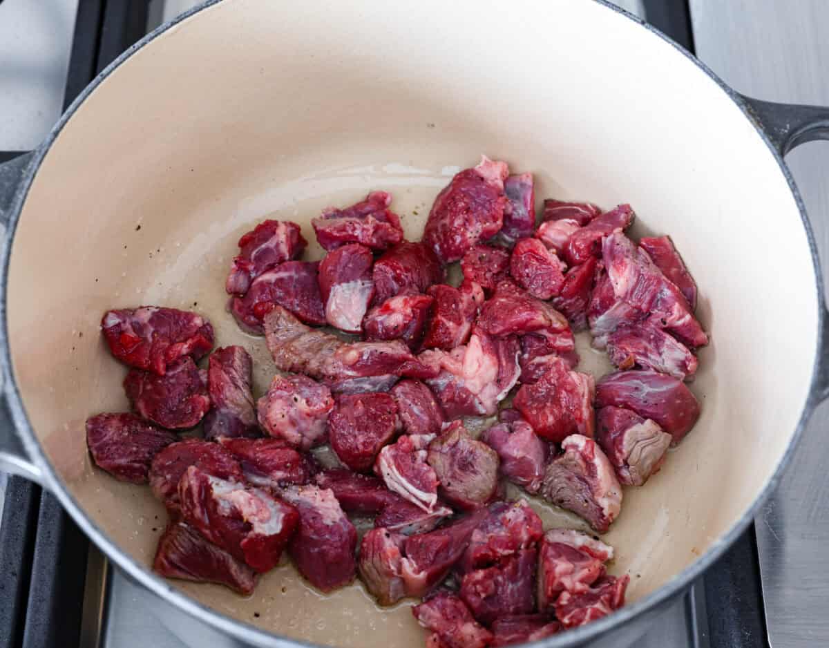 First photo of the beef browning in a pot.