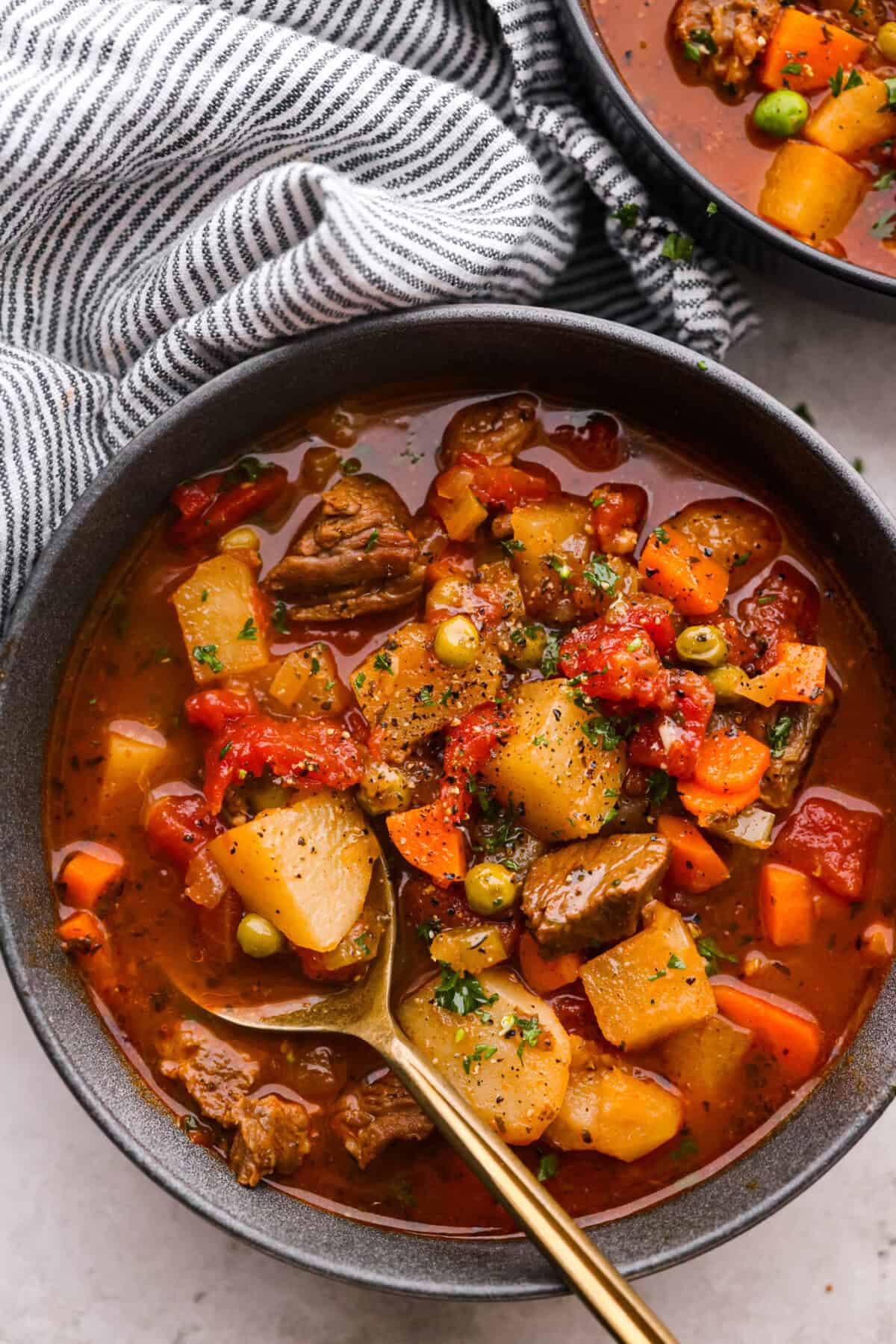 Top view of a bowl of soup with a spoon.