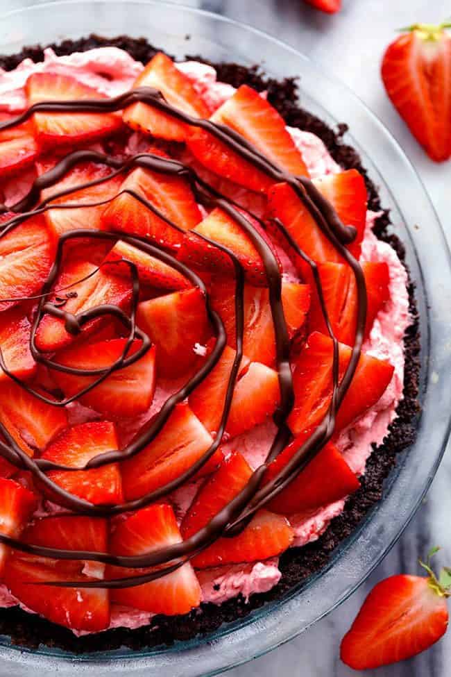 Overhead photo of No Bake Chocolate Strawberries and Cream Pie in a clear pie dish. 