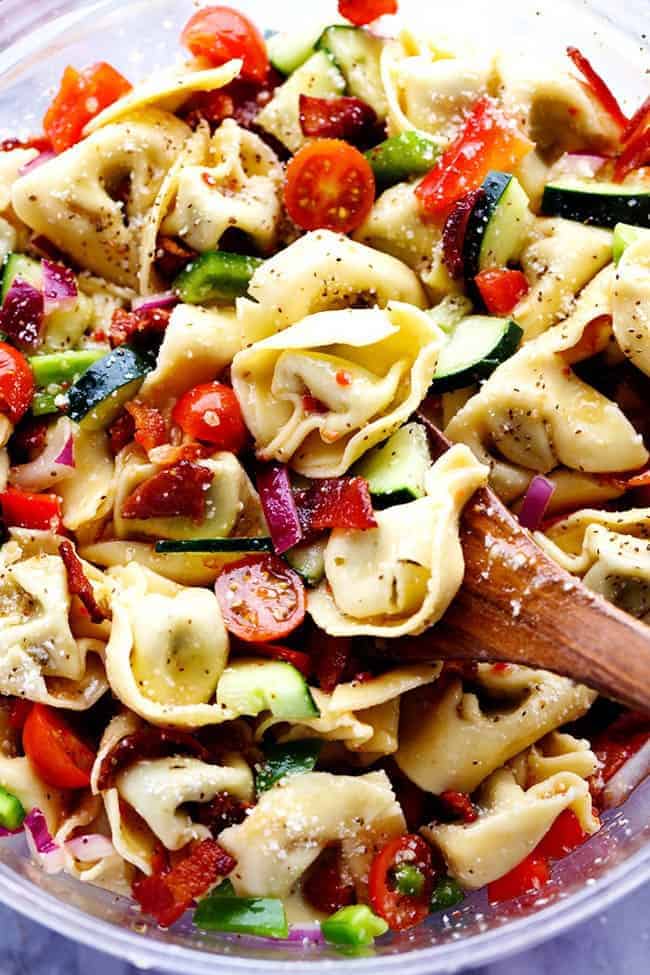 Zesty Tortellini Bacon Vegetable Salad in a clear bowl. 