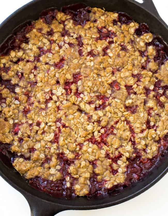 Strawberry Crisp in a large black skillet. 