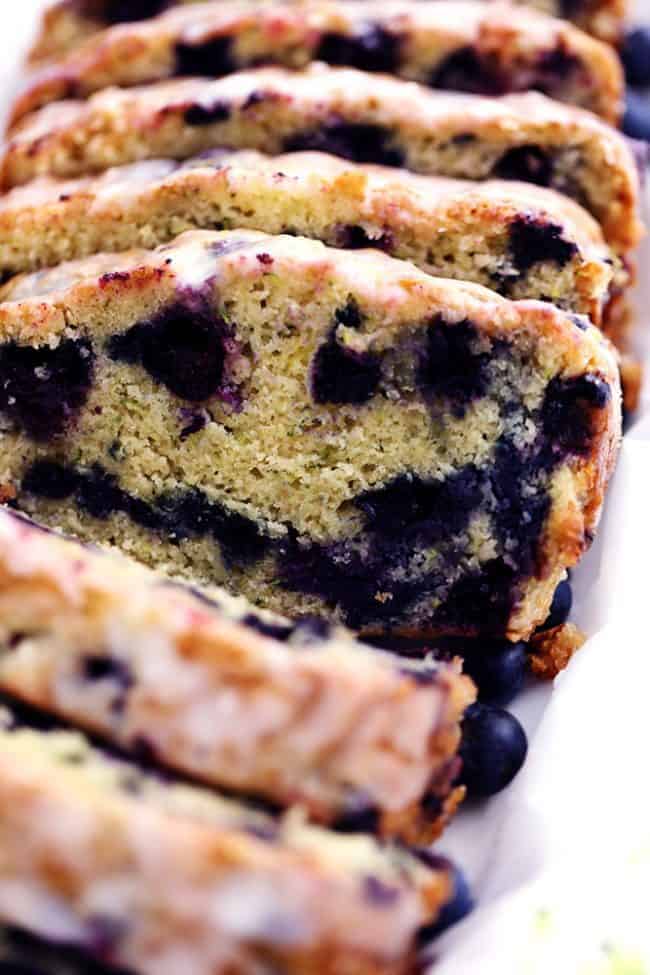 Blueberry Zucchini Bread with a Lemon Glaze that has been sliced. 