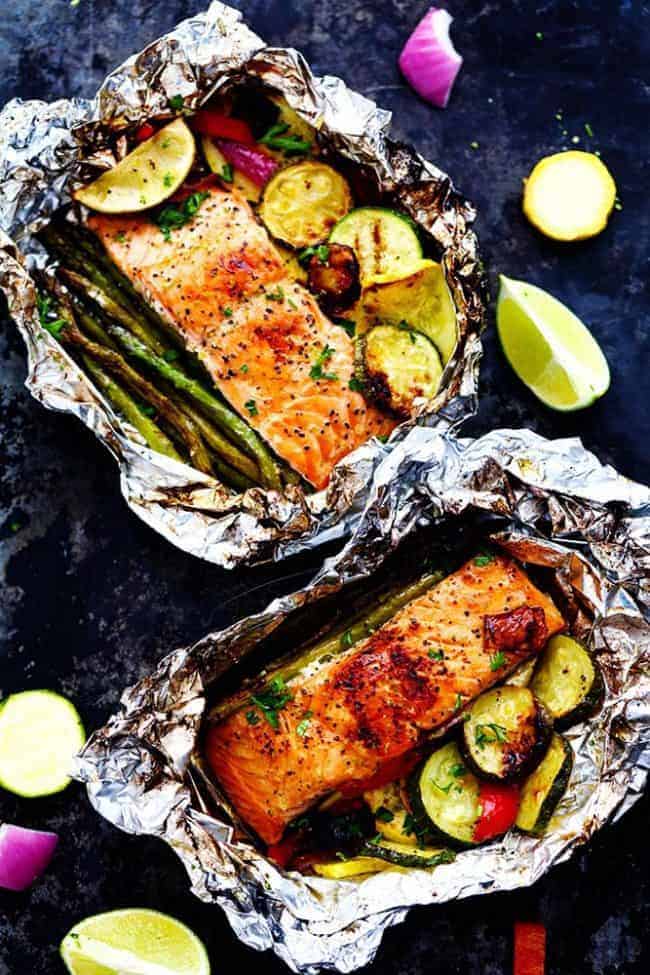 Lime Butter Salmon in Foil with Summer Veggies with the foil open to see the salmon. 