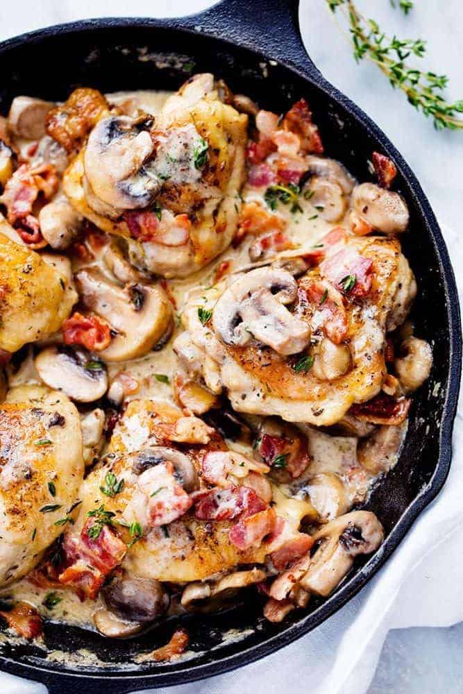 Creamy Bacon Mushroom Thyme Chicken in a skillet. 