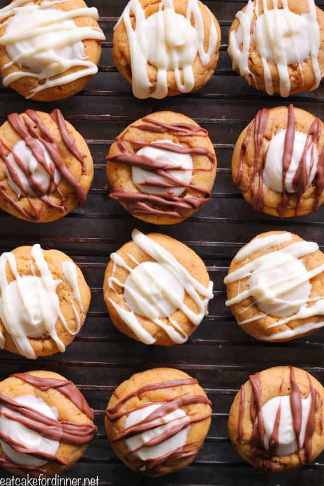 12 Pumpkin Thumbprint Cookies on a cooling rack.