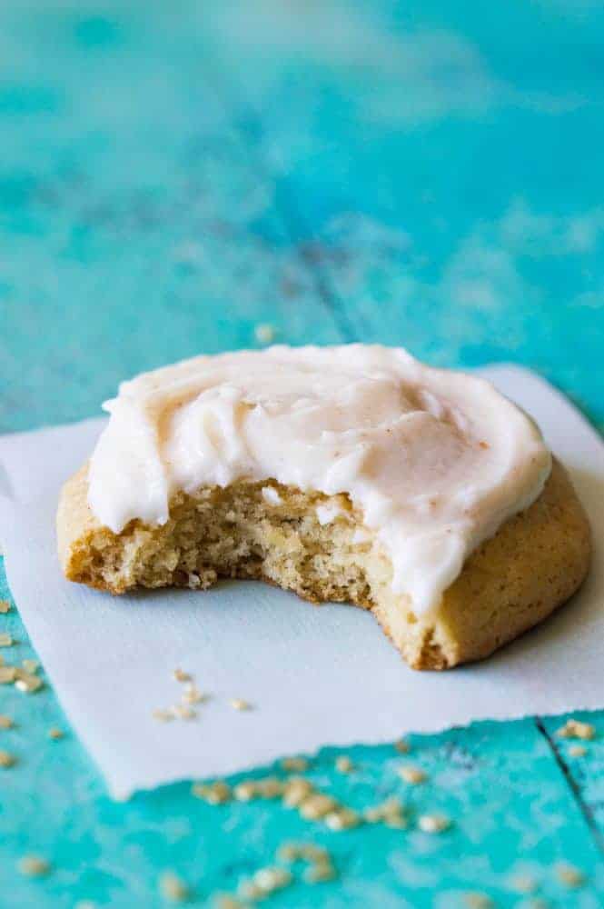 Maple cookies with the brown butter frosting with the bite taken out of it.