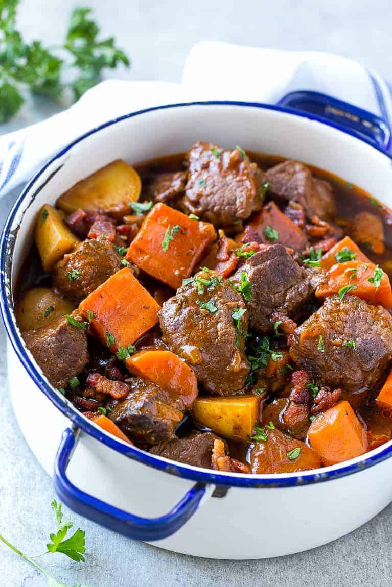 This beef stew is full of tender meat, colorful veggies and plenty of smoky bacon. A one pot meal that's perfect for cold weather!