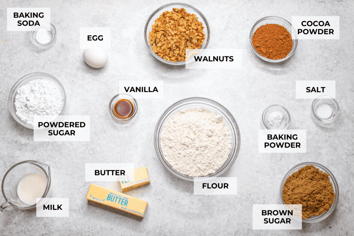 Ingredients listed and labeled to make chocolate snowball cookies.