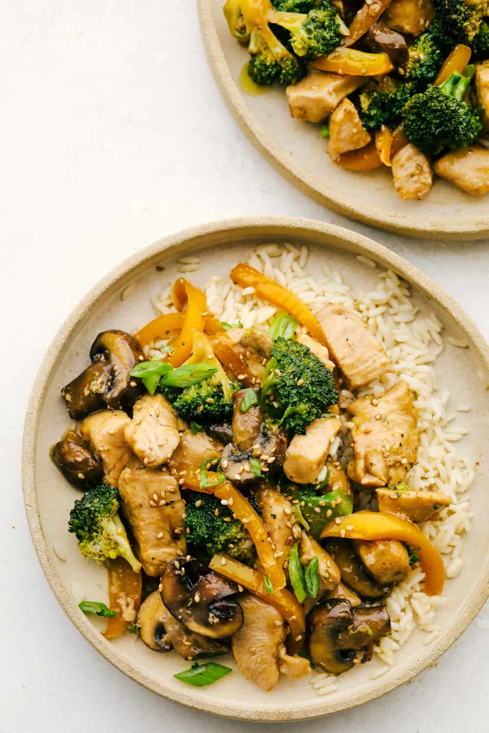 Garlic Chicken Stir fry on a plate with rice.