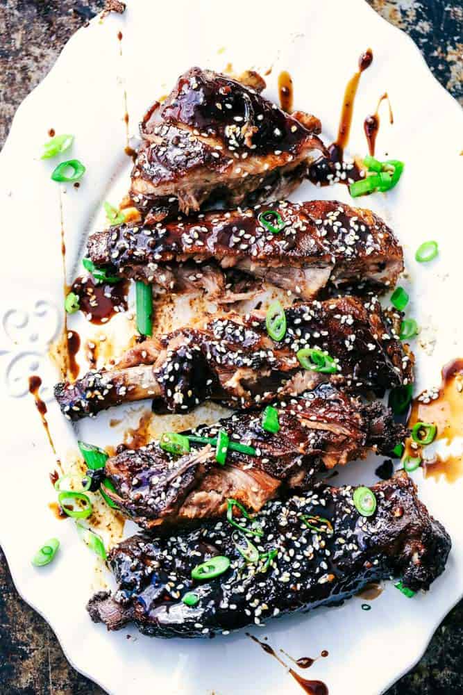 Slow Cooker Sticky Asian Ribs with Sticky Sauce on a white plate.