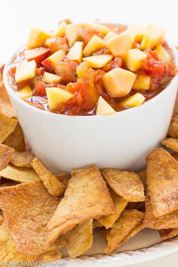 Fresh Fruit Salsa in a white bowl surrounded by chips.