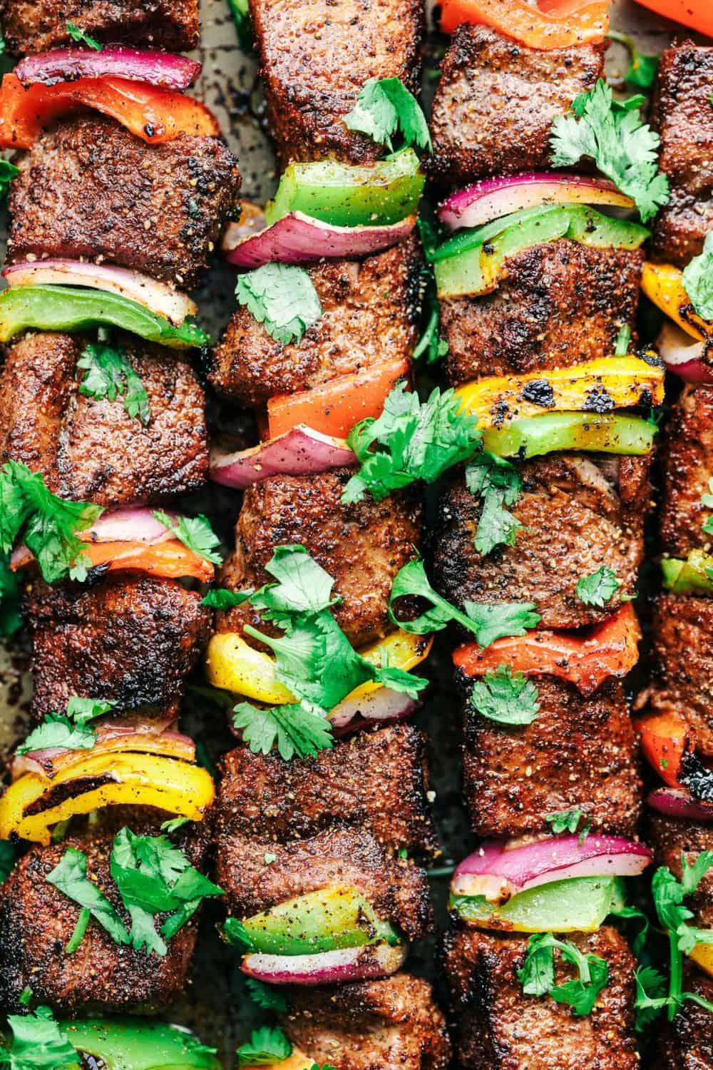 Grilled Steak Fajita Skewers with Avocado Chimichurri close up.