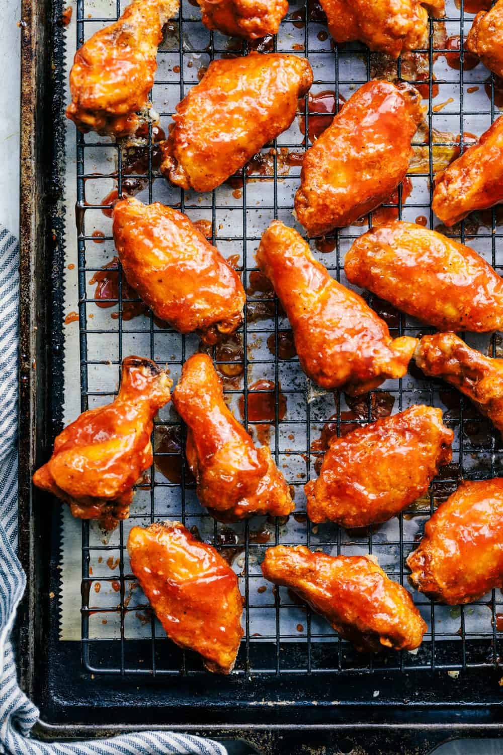 Baked Sticky Honey Garlic Buffalo Wings on a cooling rack.