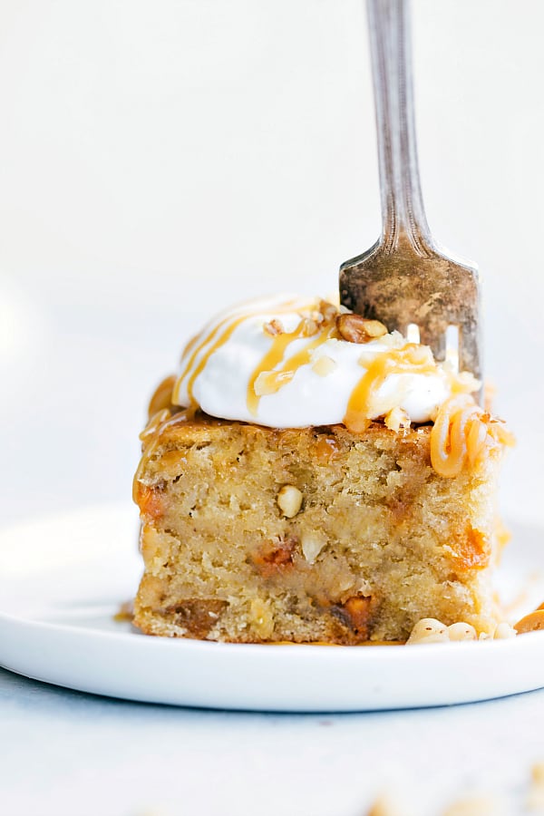 Sticky Banana Walnut Toffee Pudding Cake on a white plate.