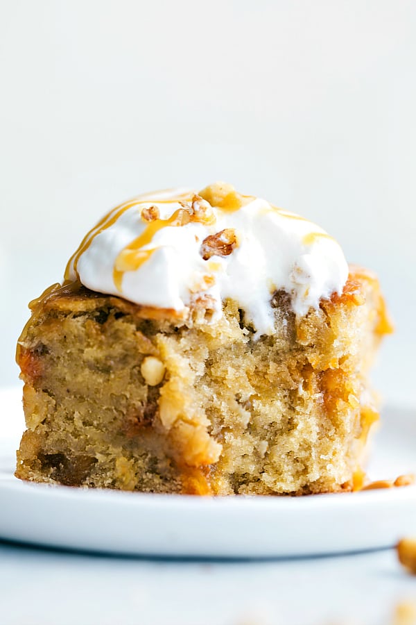 Sticky Banana Walnut Toffee Pudding Cake on a white plate.