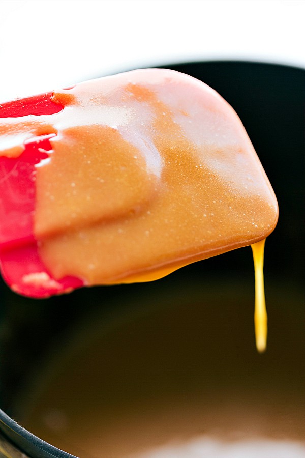 Caramel dripping off a spatula.