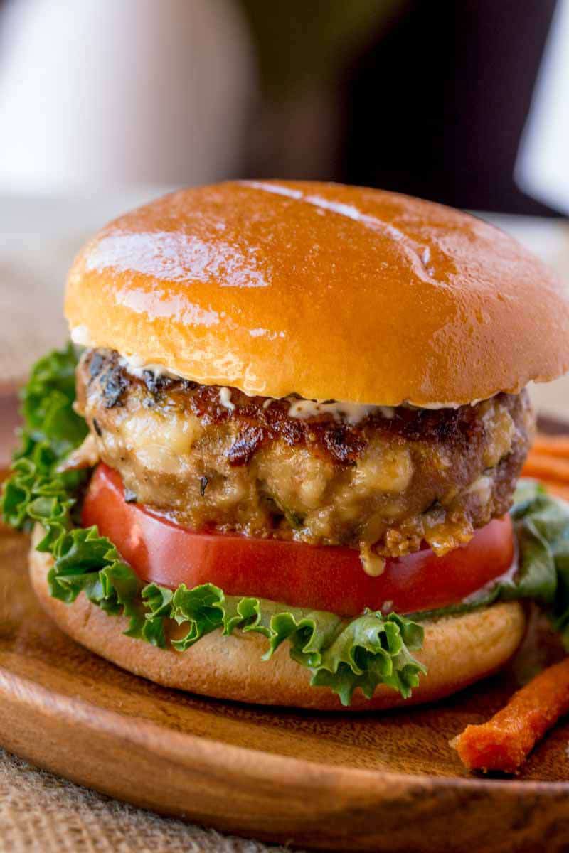 Spinach Feta Turkey Burgers with fresh spinach, salty crumbled feta cheese and a super tender turkey patty topped with lemony greek yogurt.