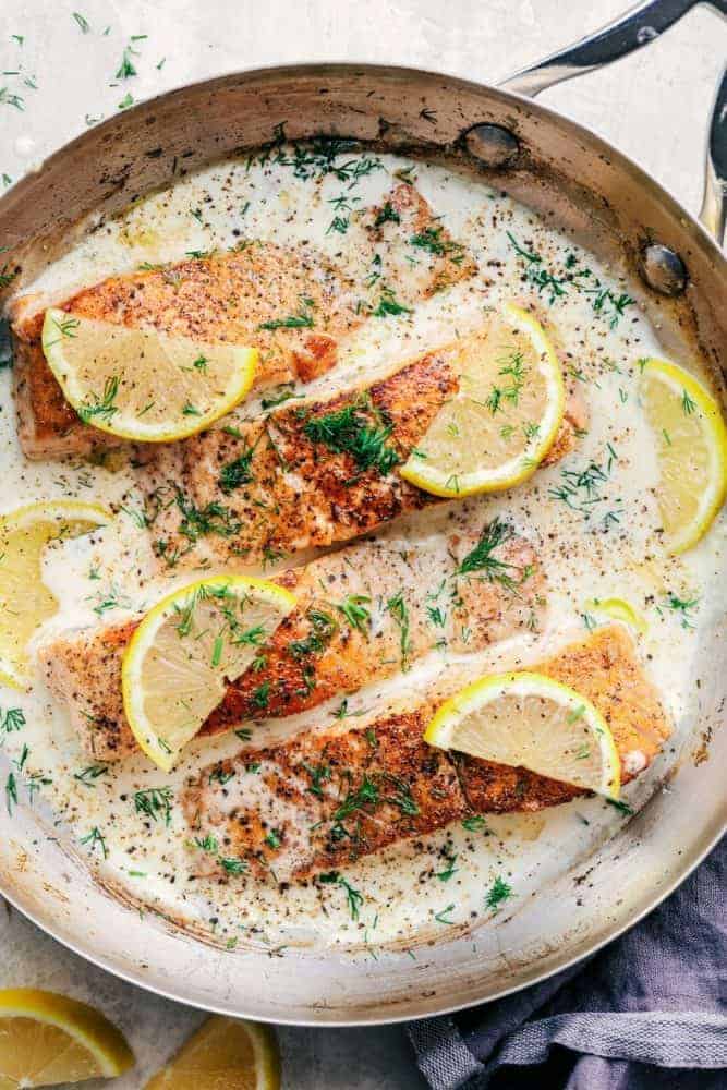 Pan Seared Salmon with a Creamy Lemon Dill Sauce in a saute pan.