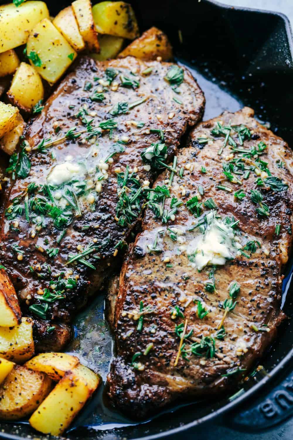 Skillet Garlic Butter Herb Steak and Potatoes in a skillet.