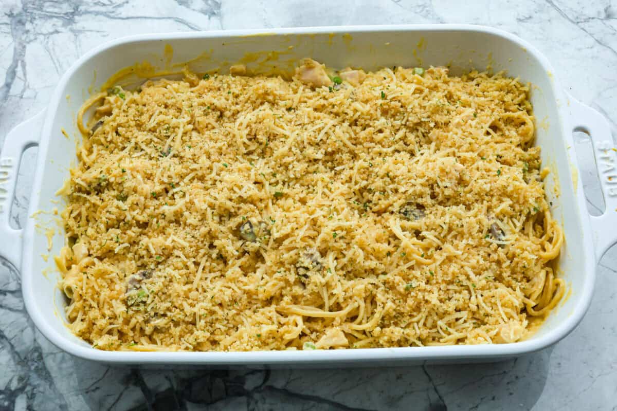 Overhead shot of chicken tetrazzini in casserole dish before its baked. 