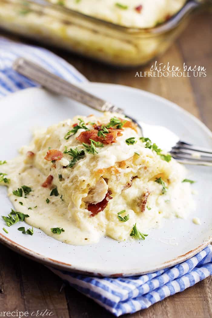 Chicken Bacon Garlic Alfredo Roll-Ups on a white plate.