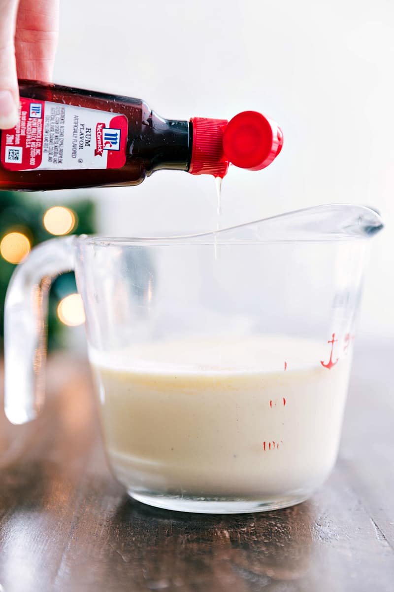 Pouring Rum flavor into measuring cup.