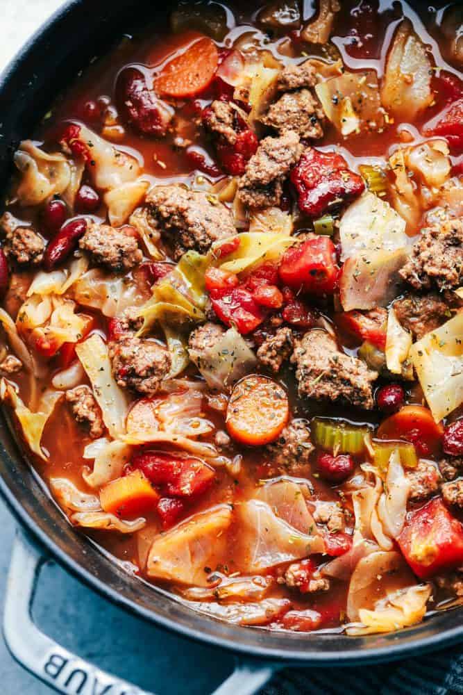 Beef and cabbage soup in an iron pot. 