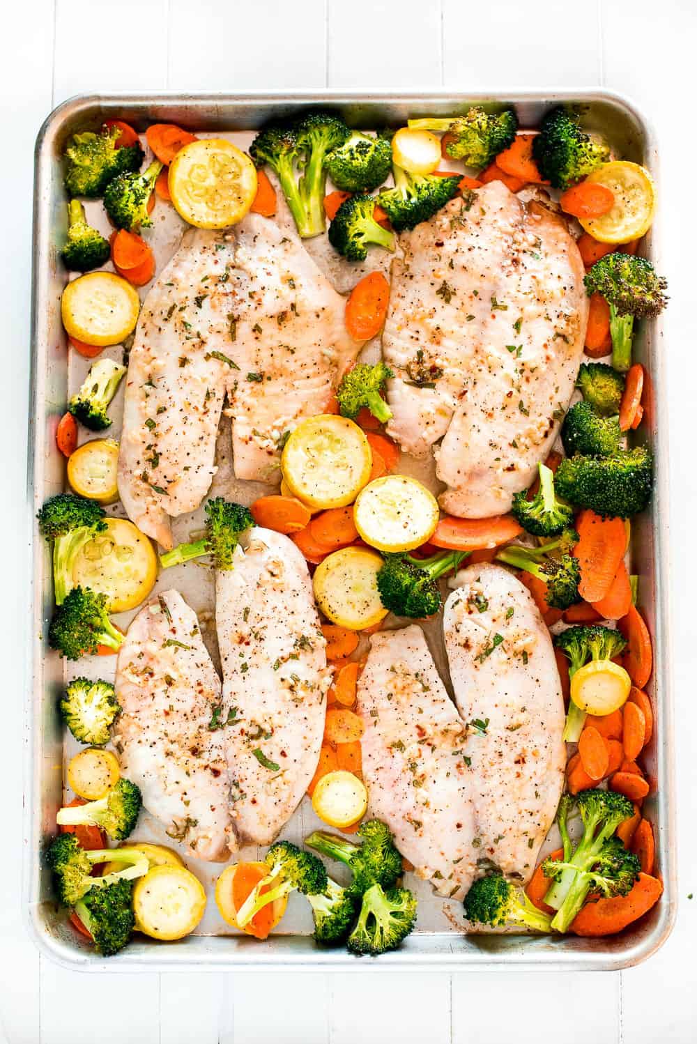 Baked Tilapia and Roasted Veggies on a pan