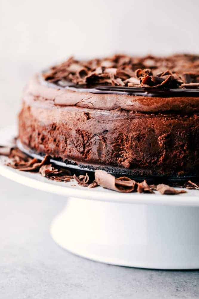 Death by Chocolate Cheesecake on a cake stand. 