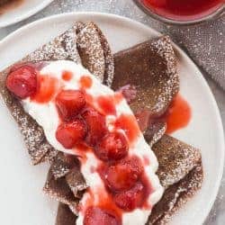 chocolate crepes with strawberries and whipped cream