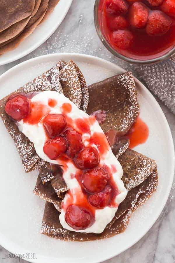 chocolate crepes with strawberries and whipped cream