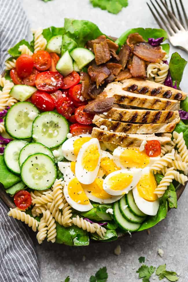 Closeup of Balsamic Chicken Cobb Salad with two forks. 