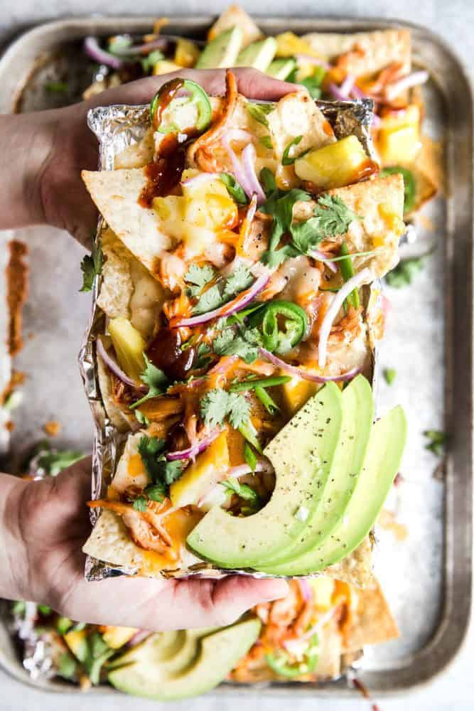 Close up of BBQ Chicken Nachos with fresh avocado on top. 