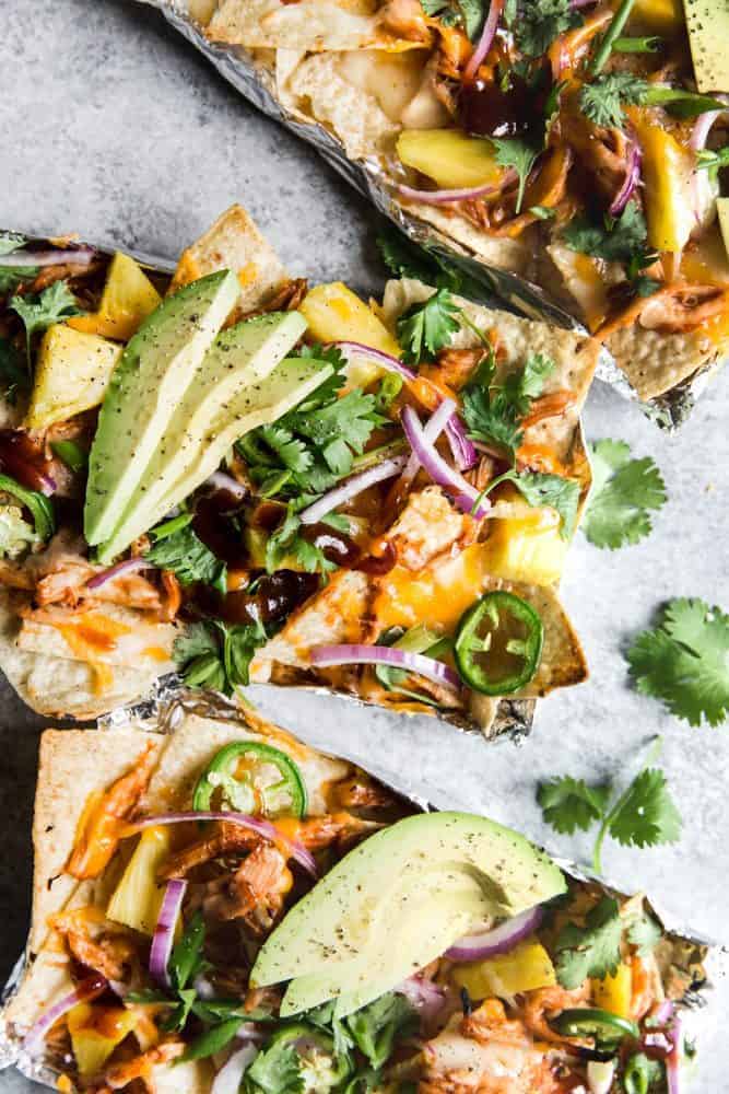 BBQ Chicken Nachos with fresh avocado on top.